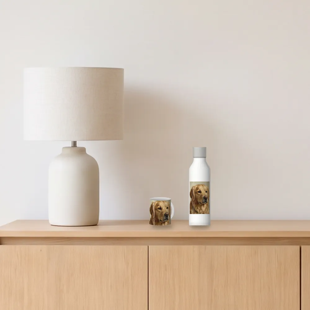 A white 11oz ceramic mug, about 9.5 cm tall, and a white 500 ml stainless steel bottle, about 26.5 cm tall, drawn to scale on a sideboard beside a table lamp, printed with an AI-made sample portrait of a golden retriever in an oil painting style. The room is an AI-made image.